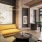 a lounge with a yellow couch and large windows