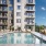 a swimming pool in a courtyard between buildings