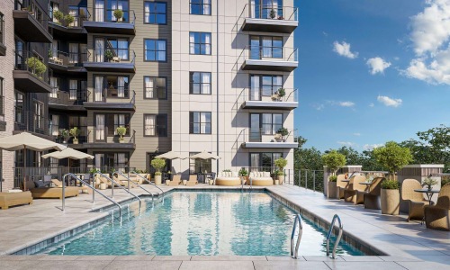 a swimming pool in a courtyard between buildings