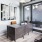 a room with a desk and chairs