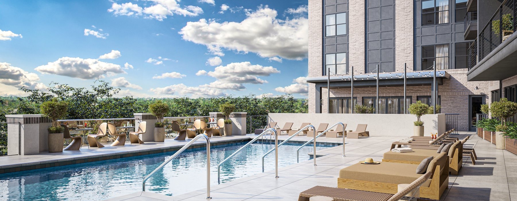 Relax and unwind poolside resort style pool with seating and a building behind